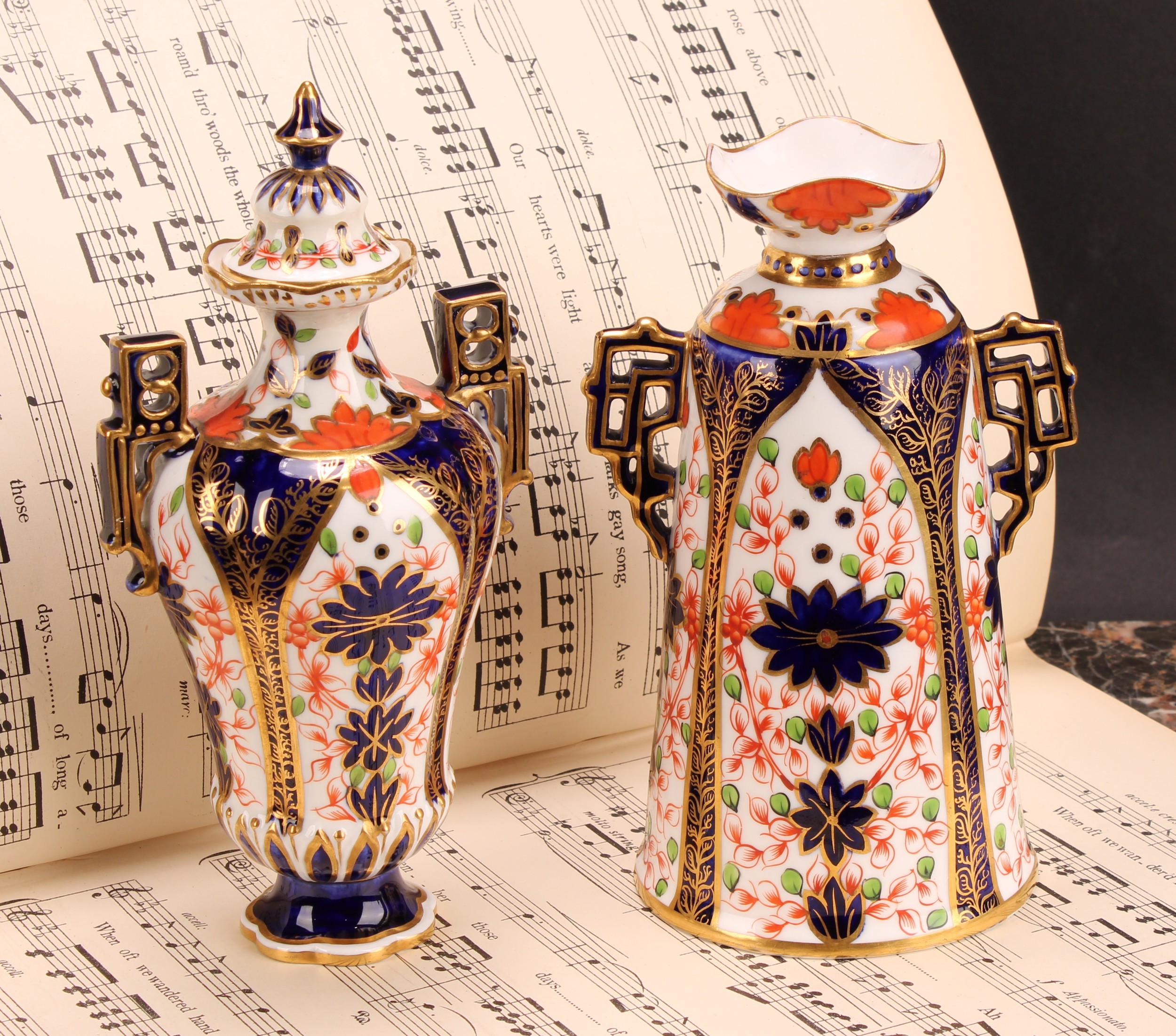 A Royal Crown Derby Imari elongated ogee shaped two-handled vase and cover, Japanesque angular