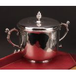 A Charles II silver porringer and cover, acorn finial, scroll handles, engraved armorial, 22.5cm