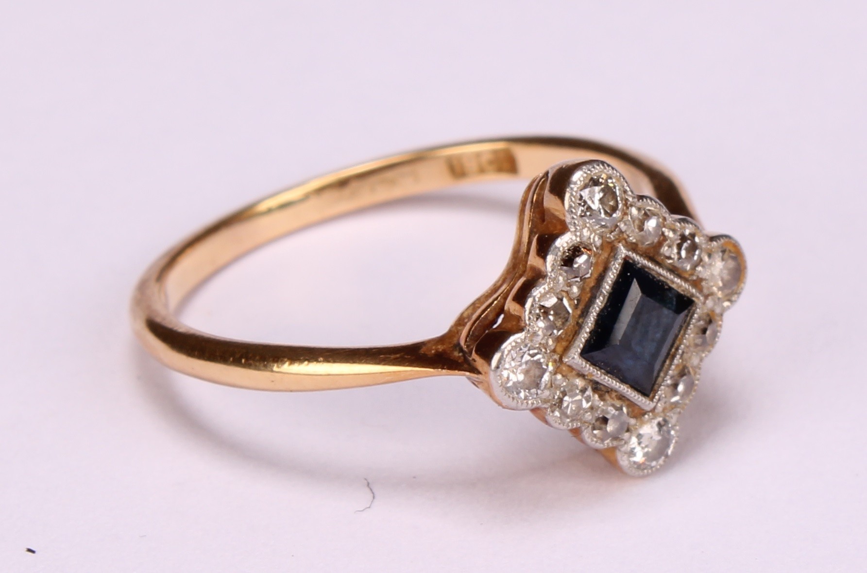 A diamond and sapphire square set cluster ring, the central cushion cut stone within a border of - Image 3 of 8