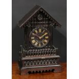 A Black Forest mantel cuckoo clock, 14cm dial applied with Roman numerals, twin winding holes, the