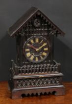 A Black Forest mantel cuckoo clock, 14cm dial applied with Roman numerals, twin winding holes, the