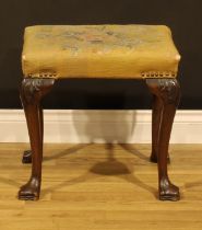 A George II Revival mahogany stool, in the 18th century Irish manner, stuffed-over upholstery,