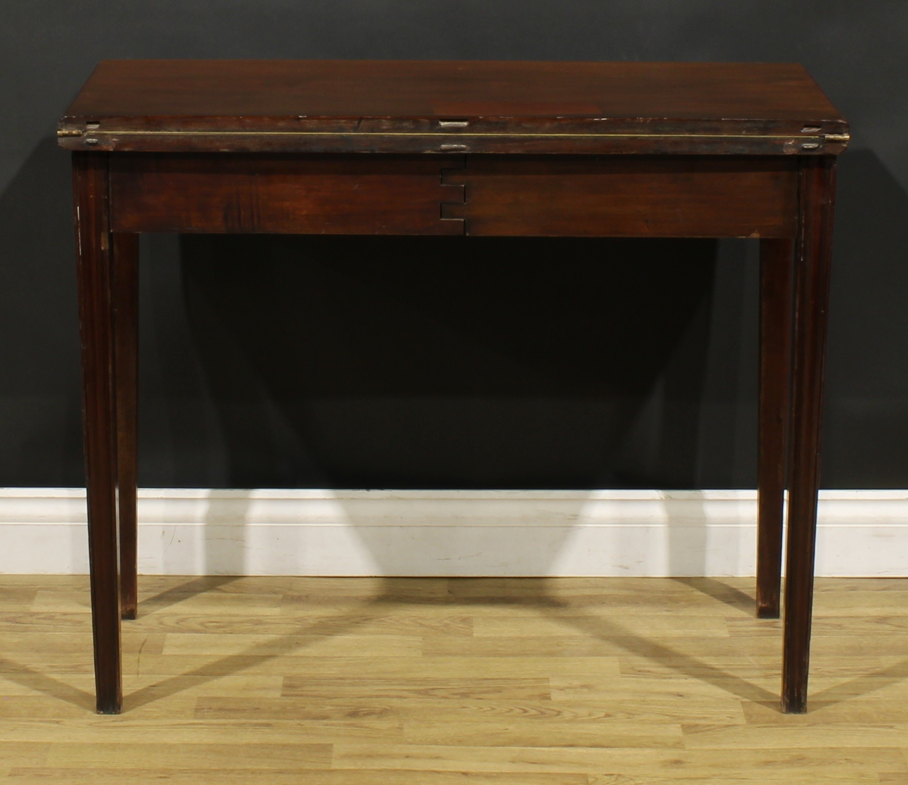 A George III mahogany card table, hinged top with moulded edge enclosing a baize lined playing - Image 7 of 7