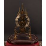 A 19th century style skeleton timepiece, in the Gothic taste, 13cm silvered clock dial inscribed