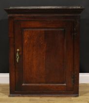 A George III oak wall hanging provision cupboard, raised and fielded panel door enclosing a shelf