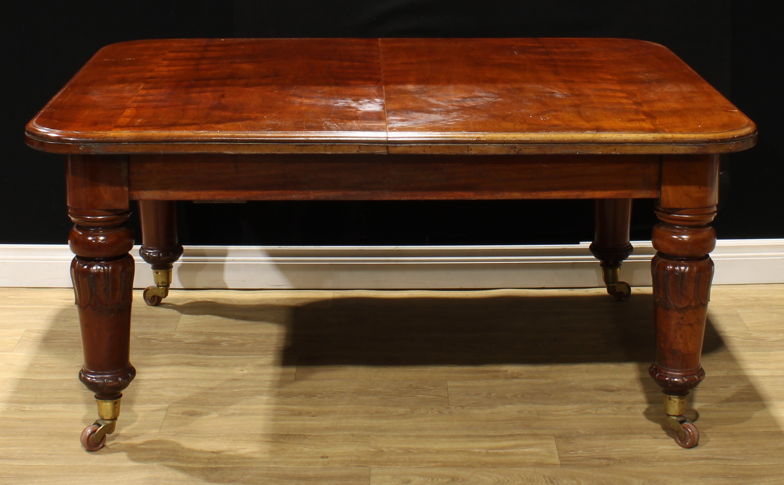 A William IV mahogany extending dining table, rounded rectangular top, four additional leaves, - Image 3 of 3