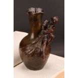 A dark patinated spelter figural vase, after Auguste Moreau, signed in the maquette, boy with full