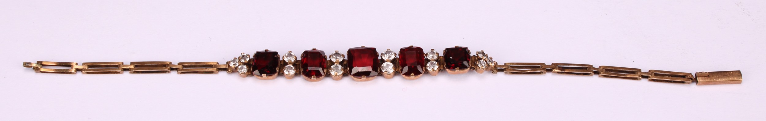 A garnet and diamond bracelet, the five graduated rectangualr mixed cut garnets divided by pairs - Image 2 of 4