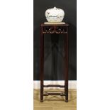 A Chinese hardwood jardiniere stand, square top with inset quartz top, shaped apron carved with