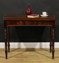 A George III mahogany tea table, hinged top, flame-veneered frieze, turned legs, 75.5cm high, 91.5cm