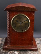 An early 20th century oak officer’s mess type mantel clock, 14.5cm circular brass dial inscribed C.