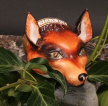 An English porcelain novelty stirrup cup, possibly Derby, modelled as a fox mask, naturalistically