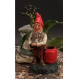 An Austrian terracotta gnome, by Johann Maresch, he stands, playing bowls, 23cm high, impressed