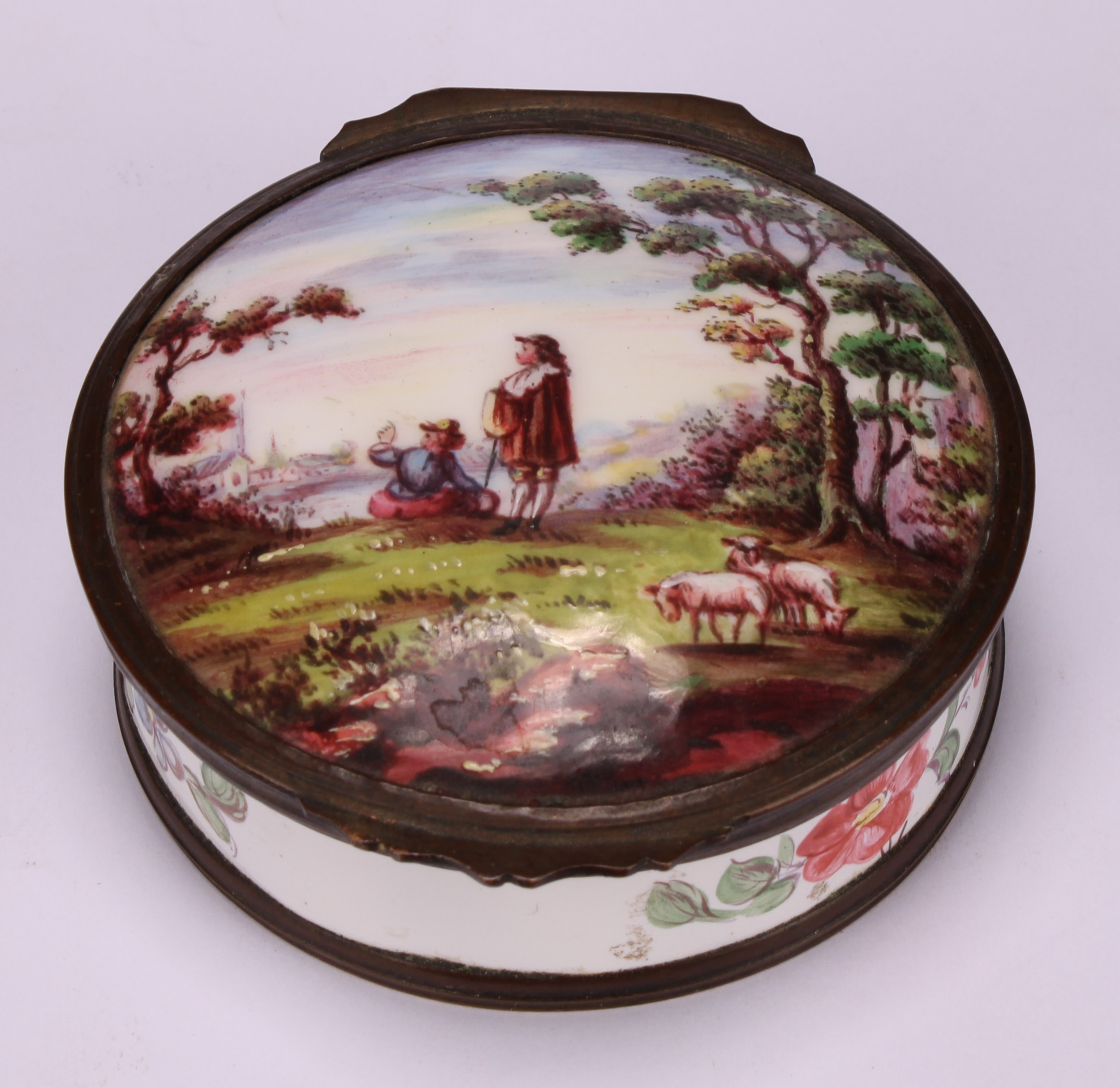 A 19th century enamel circular table snuff box, hinged cover painted with young shepherds in a - Image 2 of 5
