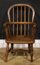 A 19th century ash and elm child’s Windsor elbow chair, 66cm high, 41cm wide