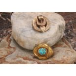 A Victorian yellow metal turquoise target brooch, lobbed oval form, turquoise cabochon beaded