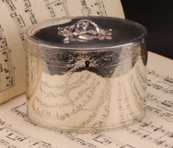 A George III silver oval tea caddy, flush-hinged cover with leafy branch finial, bright-cut engraved