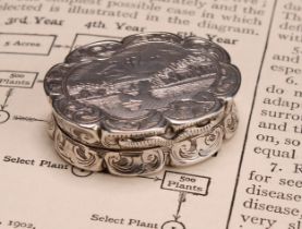 An early Victorian silver shaped oval castle top vinaigrette, the hinged cover engraved with a