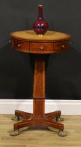 A Regency mahogany pedestal drum table, of small and neat proportions, circular top with inset