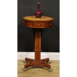 A Regency mahogany pedestal drum table, of small and neat proportions, circular top with inset