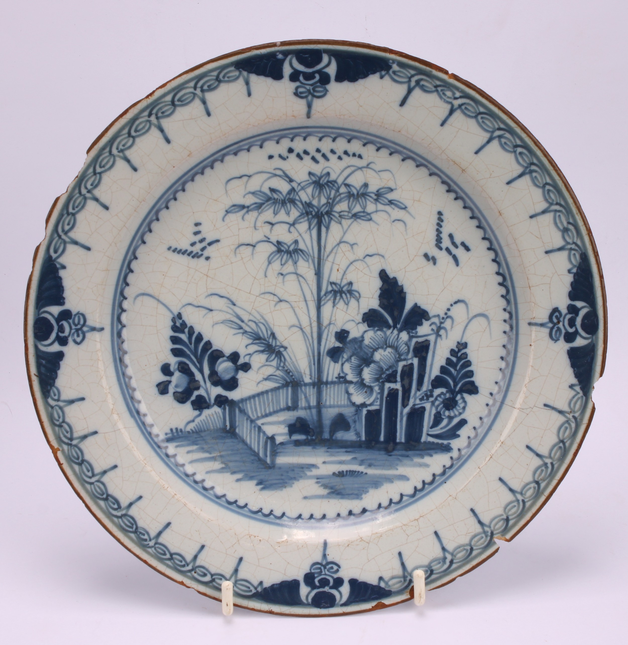 An 18th century Delft circular plate, painted in the chinoiserie taste with a figure in a Chinese - Image 6 of 18