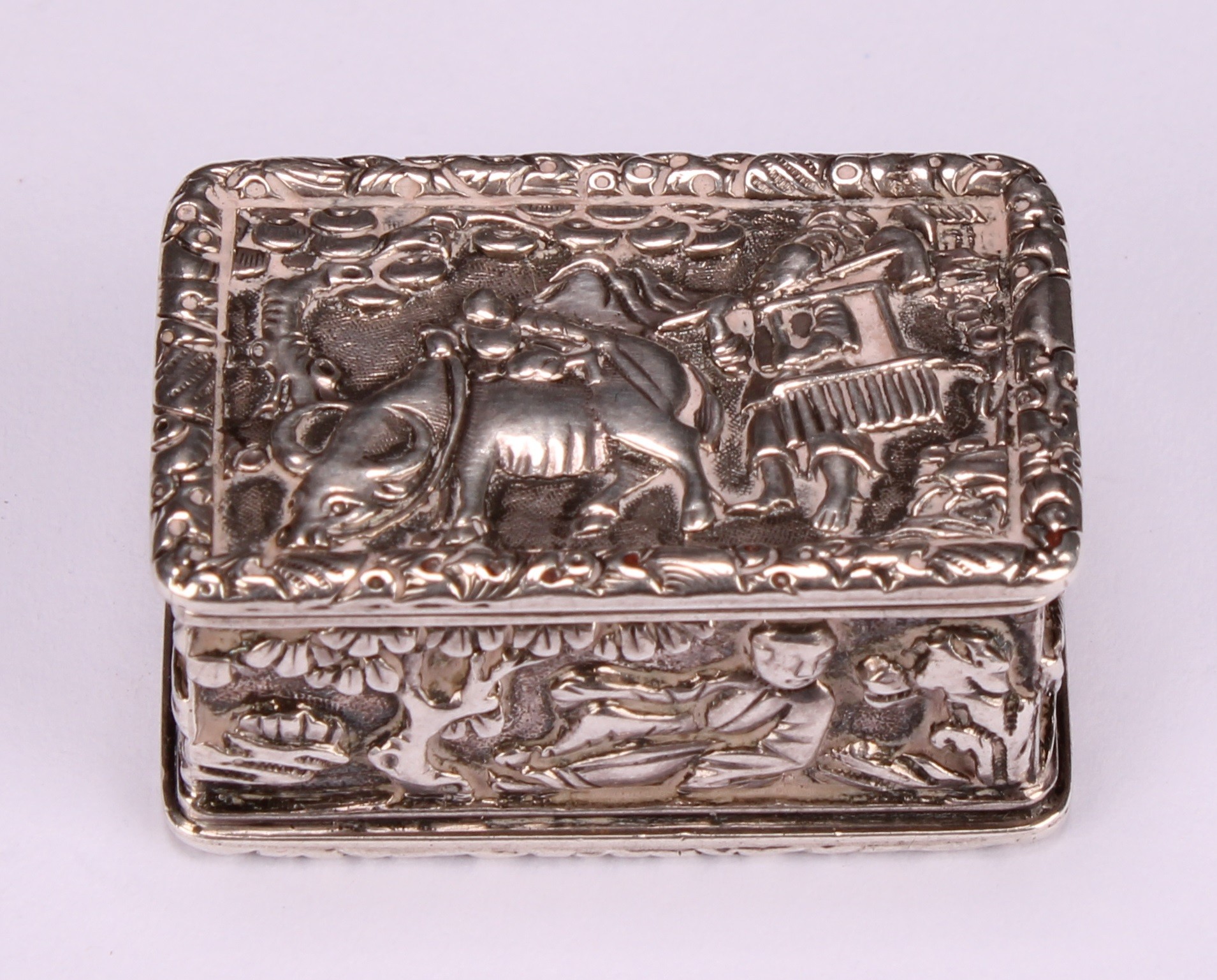 A Chinese silver rectangular vinaigrette, in relief with young boys in landscapes and riding a - Image 2 of 5