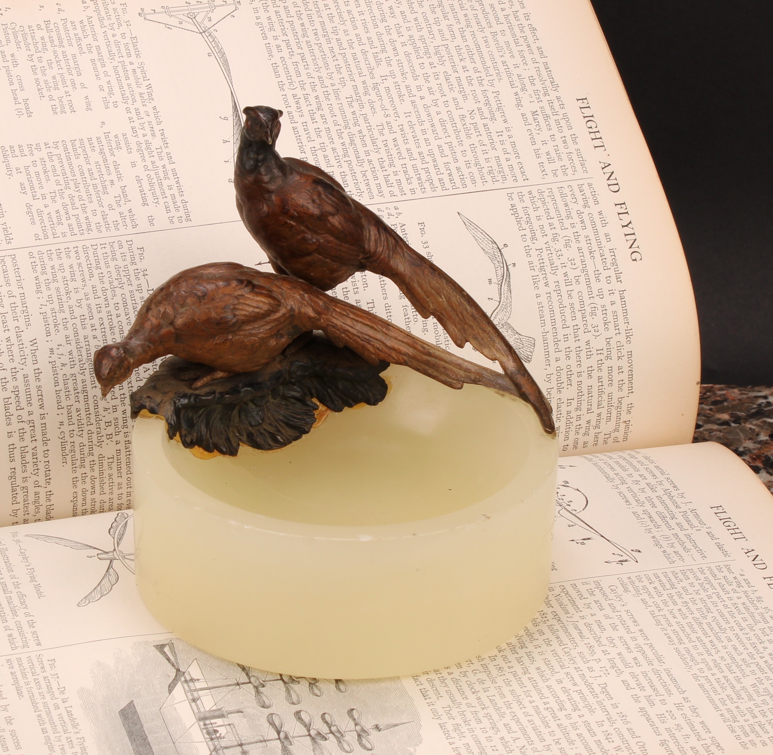 An Austrian cold painted bronze, of a pair of pheasants, surmounting a circular onyx dish, 12.5cm