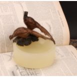 An Austrian cold painted bronze, of a pair of pheasants, surmounting a circular onyx dish, 12.5cm