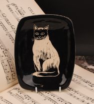 A mid-20th century studio pottery dish, by Eric Leaper for Newlyn Pottery, decorated with a cat,