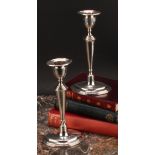 A pair of George V silver navette shaped candlesticks, tapered pillars, loaded bases, 18.5cm high,