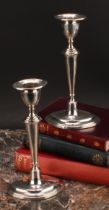 A pair of George V silver navette shaped candlesticks, tapered pillars, loaded bases, 18.5cm high,