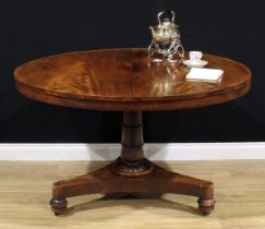 A William IV mahogany centre table, circular tilting top, turned column carved with lotus, incurve