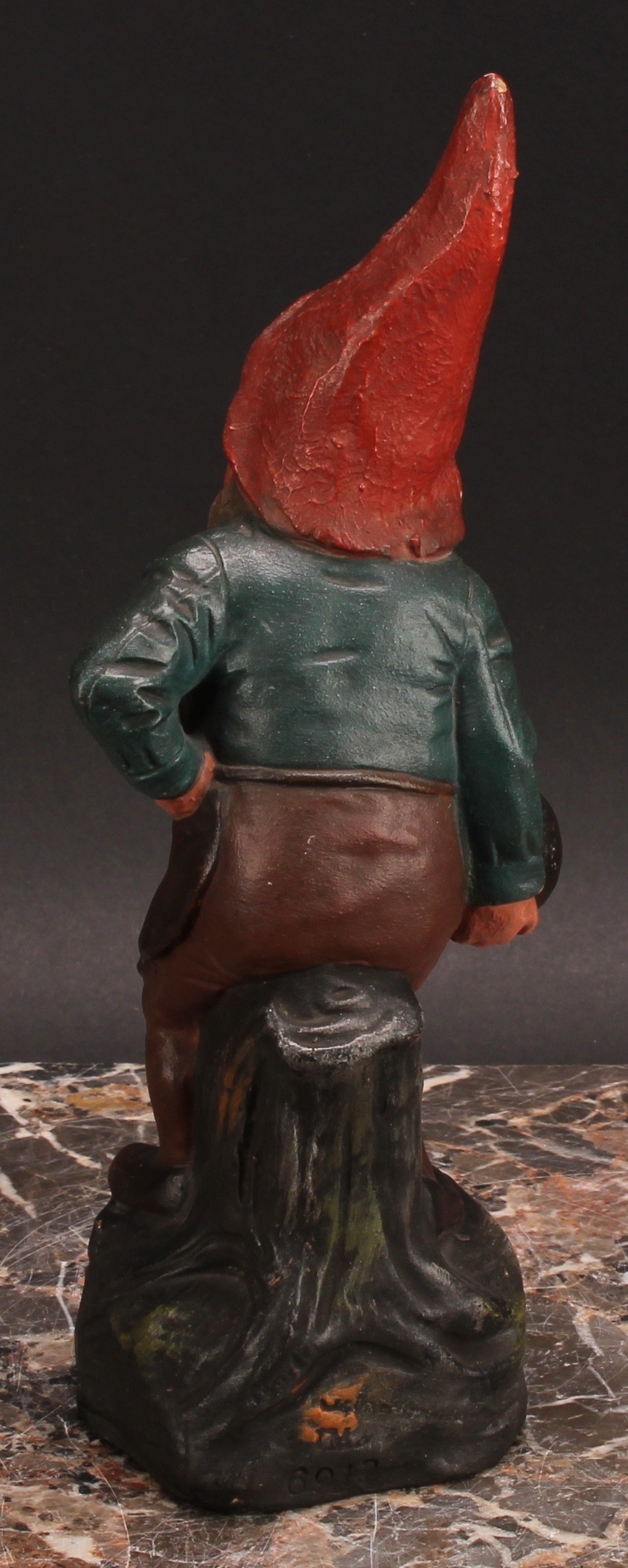 An Austrian terracotta gnome, by Johann Maresch, he stands, beside a barrel, holding a bowling wood, - Image 5 of 6