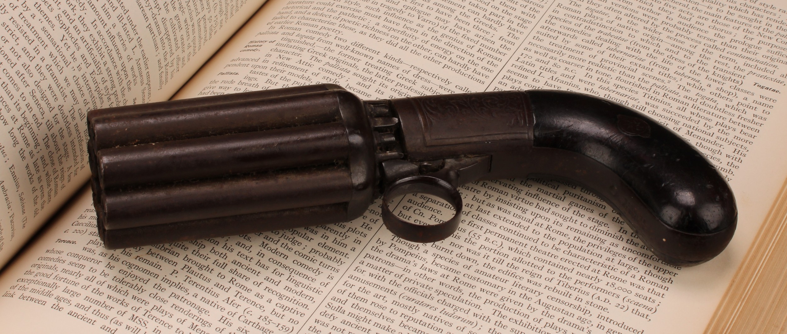 A 19th century eight-shot pepper-box revolver, 7.5cm barrel, engraved lock plate, two-piece grip,