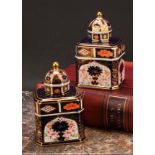 An associated pair of Royal Crown Derby 1128 Imari pattern canted rectangular tea caddies, domed