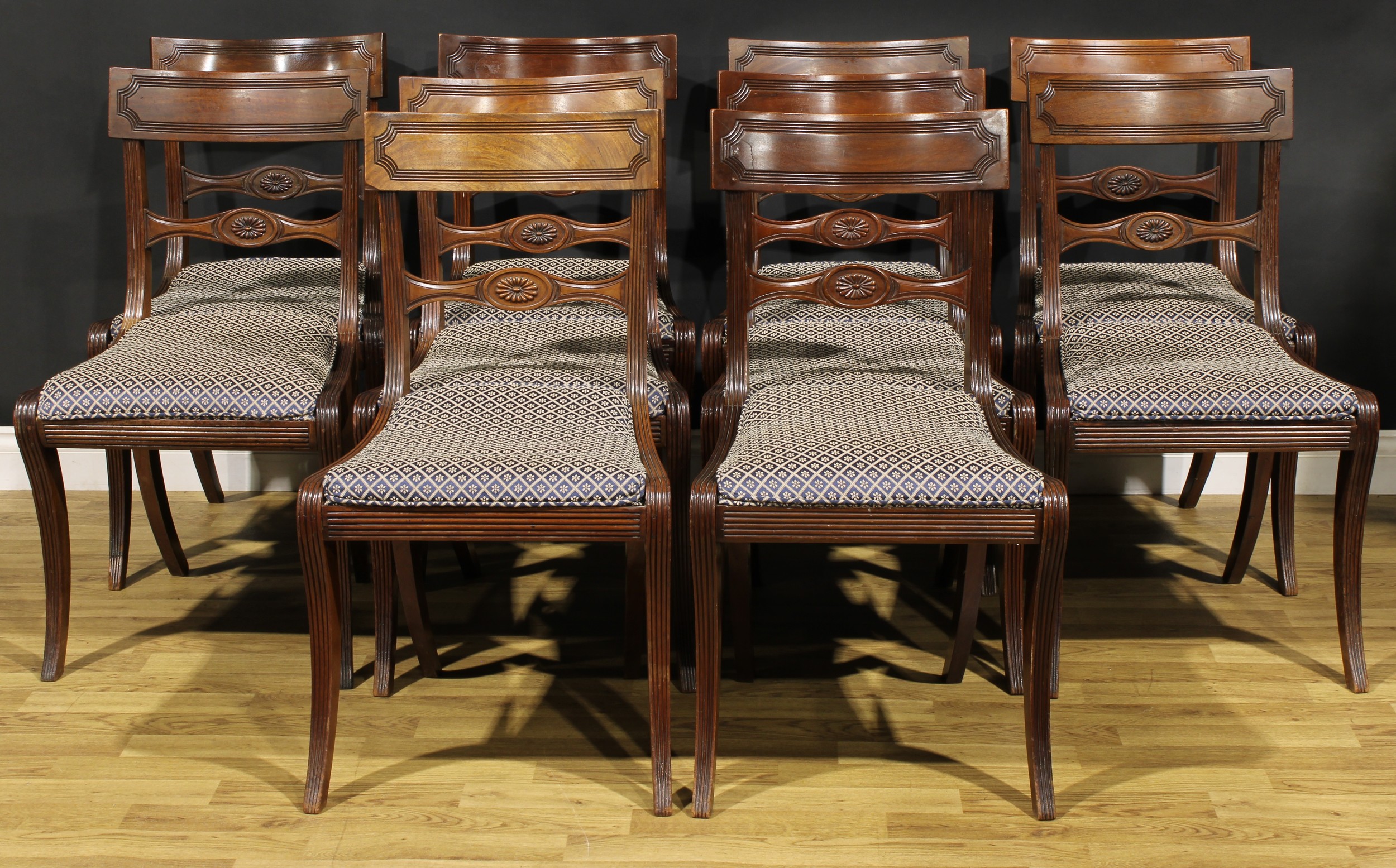 A set of ten Regency design mahogany bar-back dining chairs, comprising ten side chairs, reeded