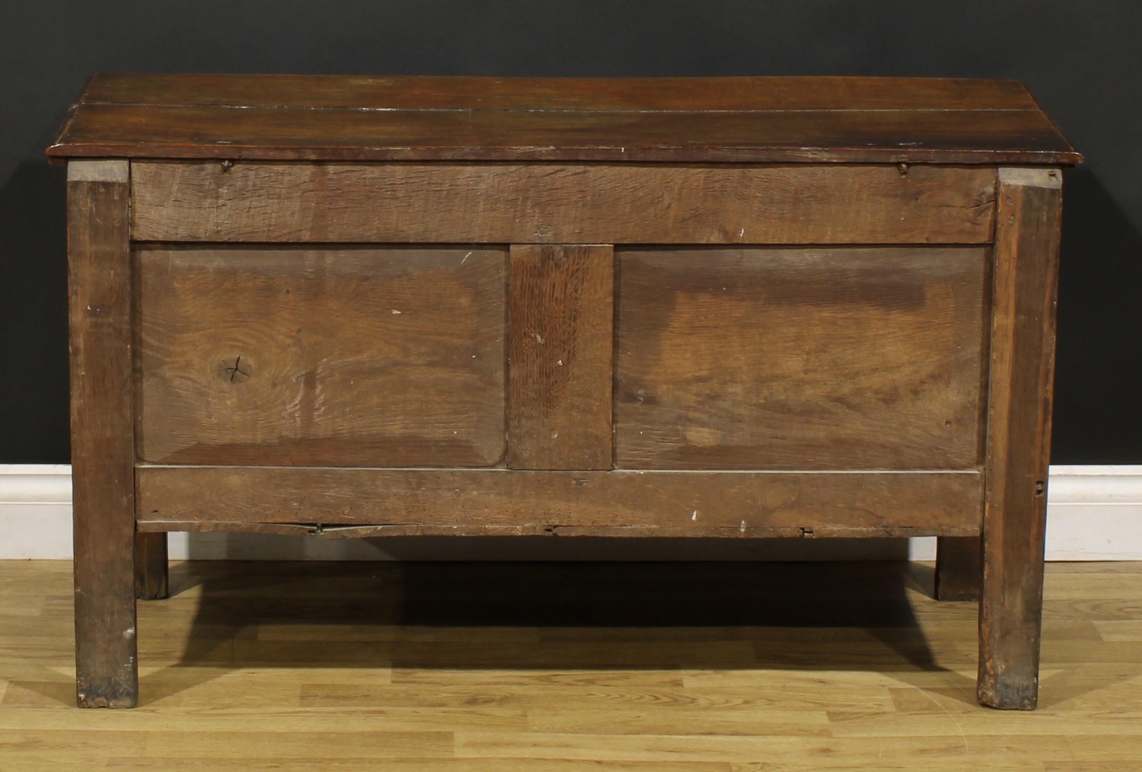 An 18th century oak blanket chest, hinged top enclosing a till above a three panel front, carved - Image 5 of 5