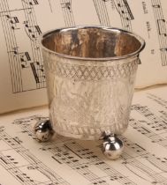 A Norwegian silver bucket shaped beaker, wriggle-work engraved, ball feet, 7cm high, unmarked, dated
