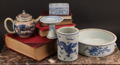 A 19th century Chinese stem cup, decorated in underglaze blue with central flowerhead and foliate