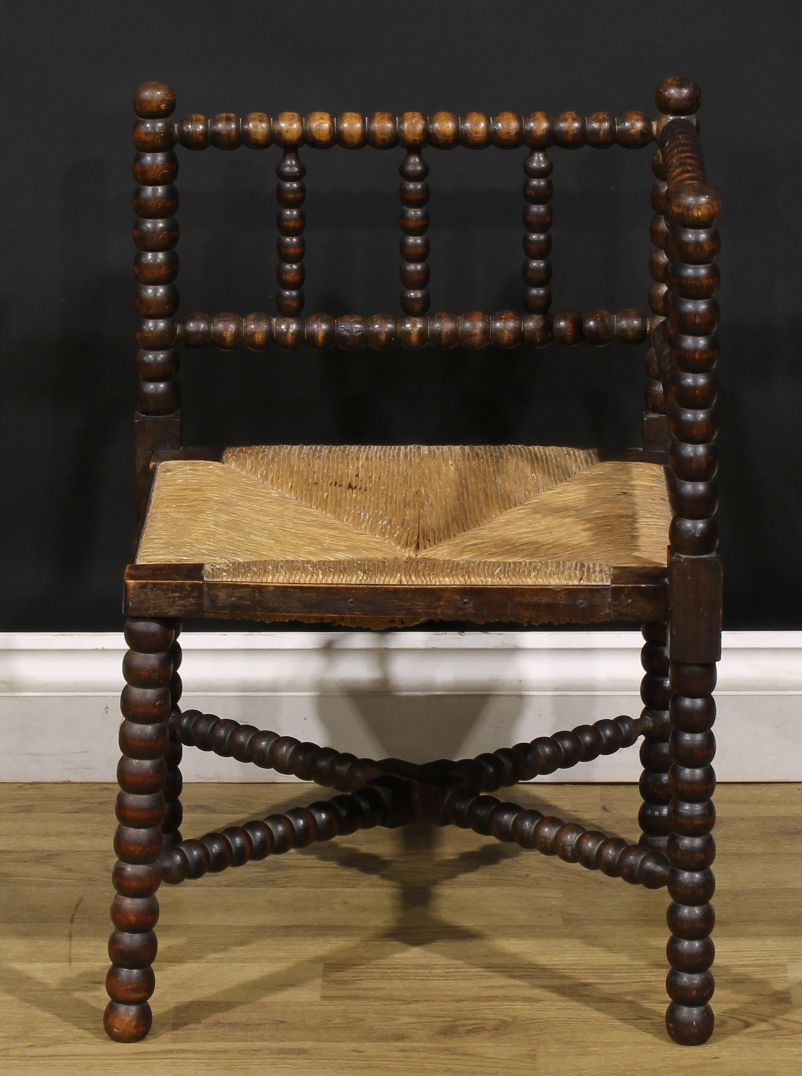 An Arts & Crafts beech bobbin-turned corner chair, of small proportions, rush seat, 60.5cm high, - Image 3 of 4