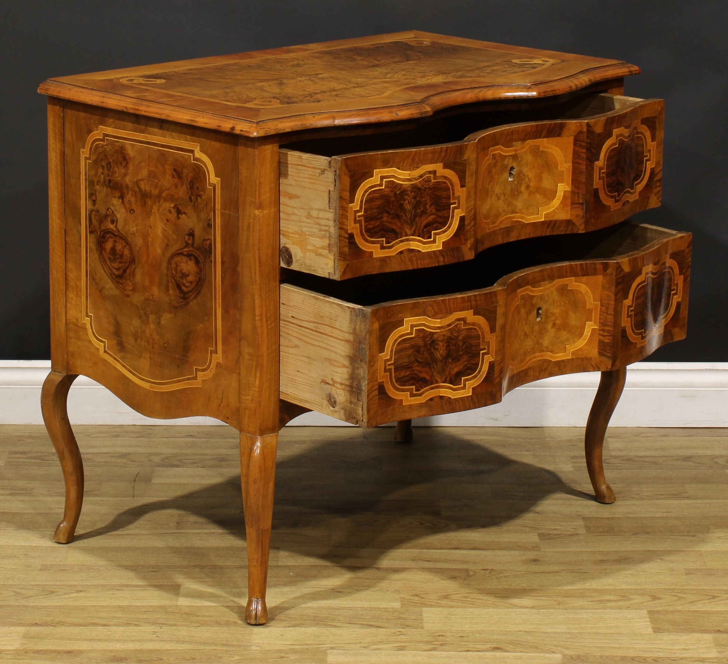 An 18th century style Italian walnut serpentine commode, oversailing top above a pair of long - Image 4 of 6