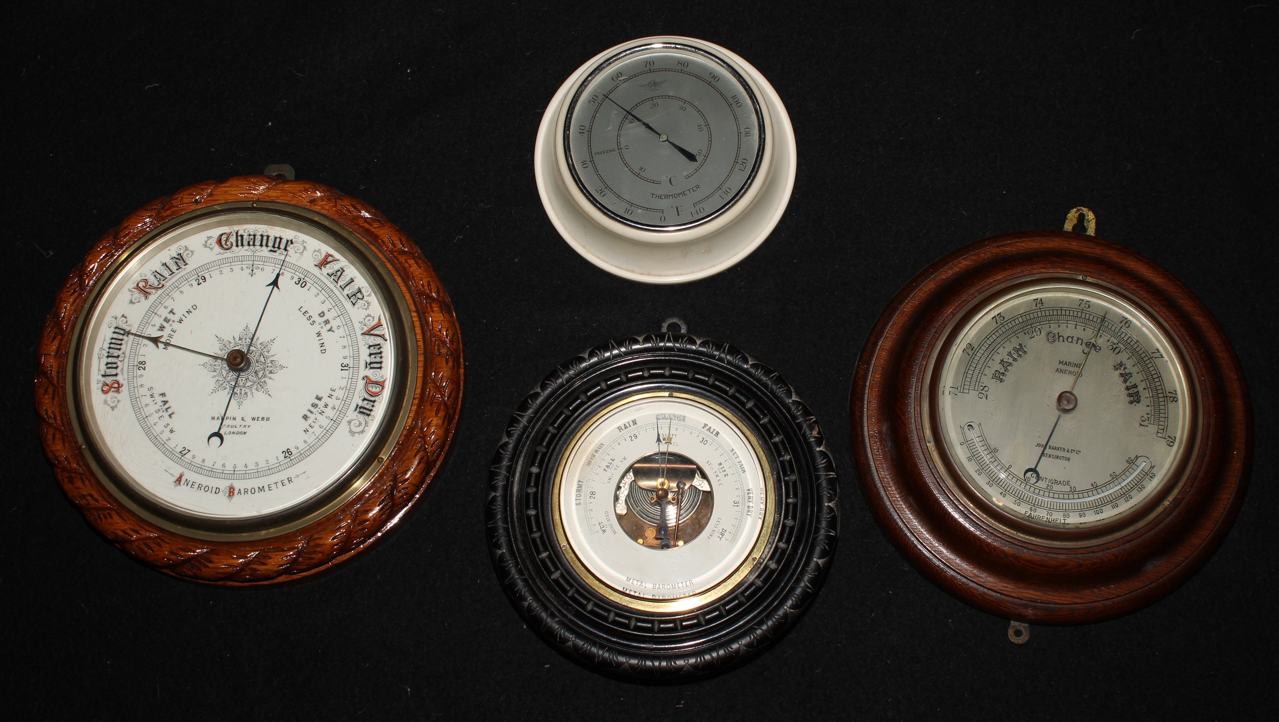 A Victorian oak circular aneroid barometer, 20cm register inscribed Mappin & Webb, Poultry,