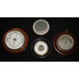 A Victorian oak circular aneroid barometer, 20cm register inscribed Mappin & Webb, Poultry,