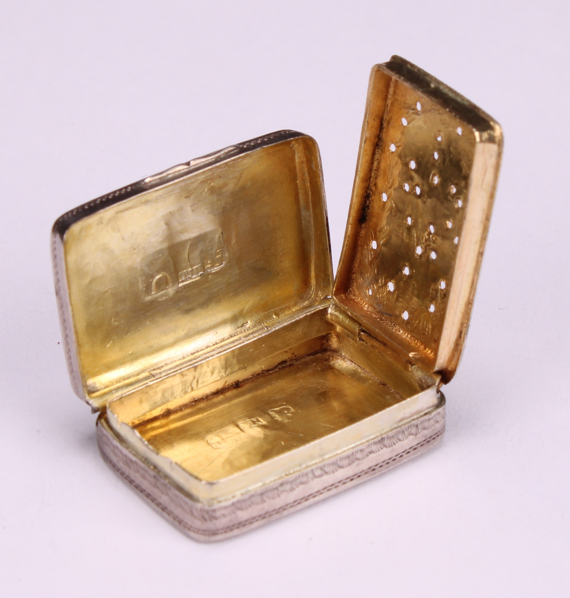 A George III silver rounded rectangular vinaigrette, hinged cover bright-cut engraved with stiff - Image 4 of 7