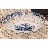 A Worcester Pine Cone pattern shaped circular basket, printed in underglaze blue with peony