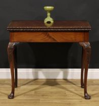 A 19th century mahogany card table, possibly Irish, hinged top with gadroon-and-ribbon edge