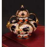 A Royal Crown Derby Imari pattern compressed ovoid two-handled pedestal vase, domed cover, scroll