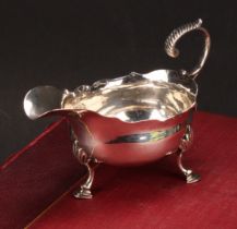 A George III silver sauce boat, acanthus-capped flying scroll handle, wavy rim, hoof feet, 13cm