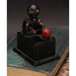 A Japanese Kobe mechanical wooden toy, as a comical figure eating an apple, rectangular base, 9cm