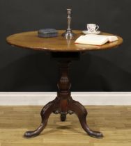 A George III mahogany tripod occasional table, circular tilting top, baluster column, cabriole